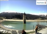 Archived image Webcam Lake Resia and the symbol of Venosta Valley 13:00