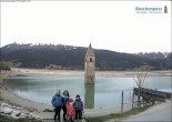 Archived image Webcam Lake Resia and the symbol of Venosta Valley 19:00