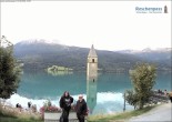 Archived image Webcam Lake Resia and the symbol of Venosta Valley 11:00