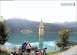 Archived image Webcam Lake Resia and the symbol of Venosta Valley 13:00