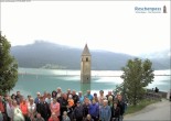 Archived image Webcam Lake Resia and the symbol of Venosta Valley 13:00