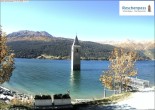 Archived image Webcam Lake Resia and the symbol of Venosta Valley 11:00