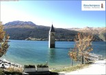 Archived image Webcam Lake Resia and the symbol of Venosta Valley 13:00