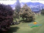 Archived image Webcam Ramsau am Dachstein: Golf course at the hotel Kobaldhof 13:00