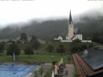 Archiv Foto Webcam Kreuth: Kirche und Freibad 12:00